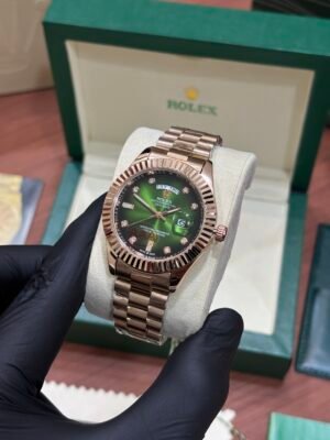 ROLEX OYSTER PERPETUAL GOLDEN GREEN DIAL