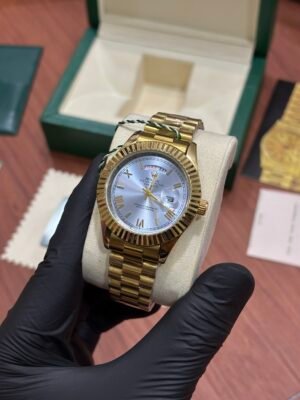 ROLEX OYSTER PERPETUAL DAY DATE GOLD SKY BLUE DIAL